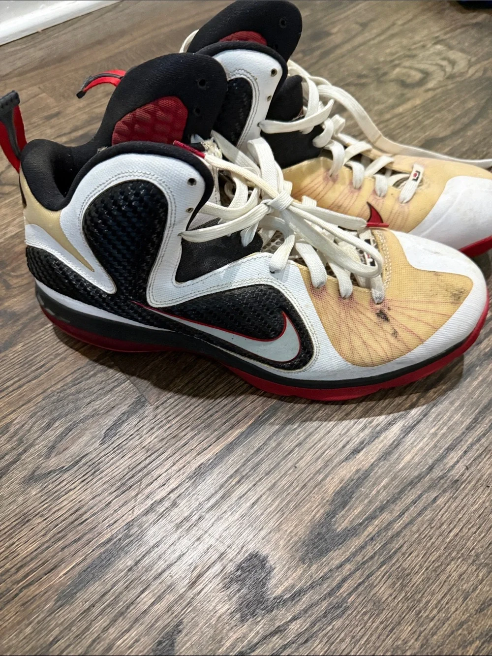 Nike men’s Black, White, Red & Gold High-Top Sneakers